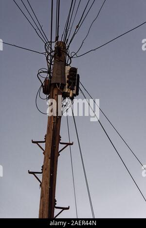 Fibre optic connections to the home are now visible on the top of telegraph poles, Twickenham, England Stock Photo