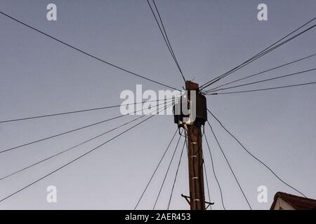 Fibre optic connections to the home are now visible on the top of telegraph poles, Twickenham, England Stock Photo