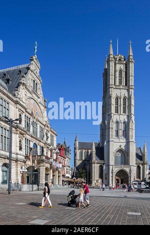 Saint-Bavo's square showing the Royal Dutch Theatre and the St-Bavo's cathedral / Sint-Baafskathedraal in the city Ghent, East Flanders, Belgium Stock Photo