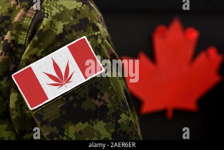 Cannabis in Canada. Cannabis leaf replacing the Maple leaf on the Canadian flag. Cannabis in Army. Stock Photo