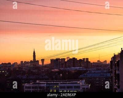 dark orange sunset sky over residential district in Moscow city in autumn evening Stock Photo