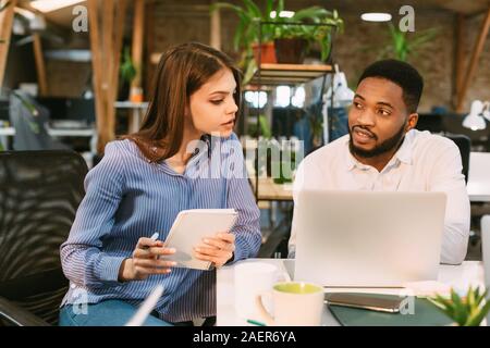 Sharing ideas. Two desingers working on project together Stock Photo