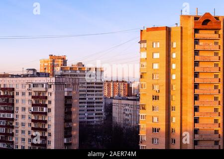 residential houses illuminated by sunrise light in Moscow city at autumn morning Stock Photo