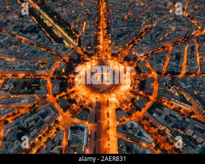 Aerial of the Arc de Triomphe in Paris, France at night Stock Photo