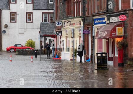 Aberfoyle, Stirlingshire, Scotland, UK. 10th Dec, 2019. UK weather - flooding on Aberfoyle Main Street after the River Forth burst its banks Credit: Kay Roxby/Alamy Live News Stock Photo