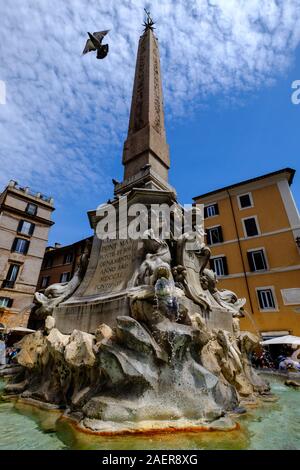 A dove launches itself into the sky from the fountain in the Piazza della Rotonda, Rome, Italy Stock Photo