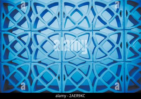 Geometrical symmetrical abstract ornament round fractal pattern background toned in trendy blue color. Modern minimalist background. Color of the year Stock Photo