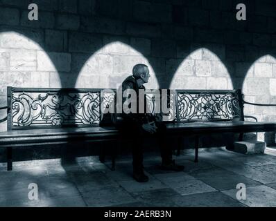 Mature man in Santander cathedral cloister. Spain Stock Photo