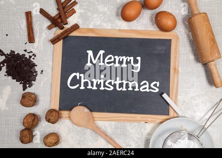 Merry christmas written on blackboard Stock Photo