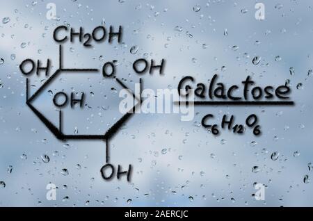 Structural model of Galactose drawn on the glass with raindrops Stock Photo