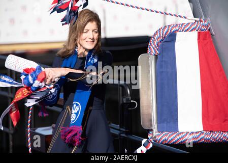 Amb. Caroline Kennedy, daughter of the late President John F. Kennedy swings a bottle of champagne to christen the new Ford-class aircraft carrier USS John F. Kennedy at Huntington Ingalls Industries December 7, 2019 in Newport News, Virginia. Kennedy is the second ship in the next-generation Ford-class of nuclear-powered aircraft carriers and the second U.S. aircraft carrier named for President Kennedy, with the former retired from service in 2007. Stock Photo