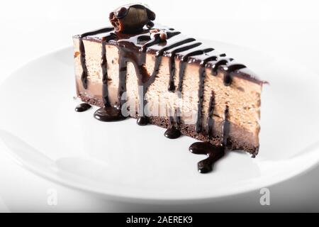 Chocolate cheesecake on a plate isolated on white background Stock Photo