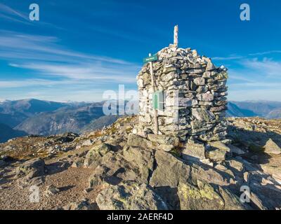 Top of mount Molden, stone cairn,  view towards north,  glacier Jostedalsbre in the background,Lustrafjord, Sogn og Fjordane, Norway, Europe Stock Photo