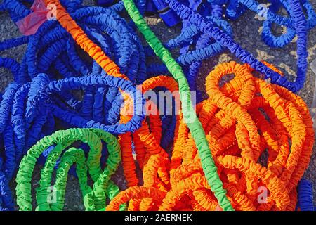 Many new expandable flexible garden hose latex Stock Photo