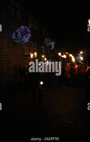 Christmas torchlight parade in Main Street Haworth Stock Photo