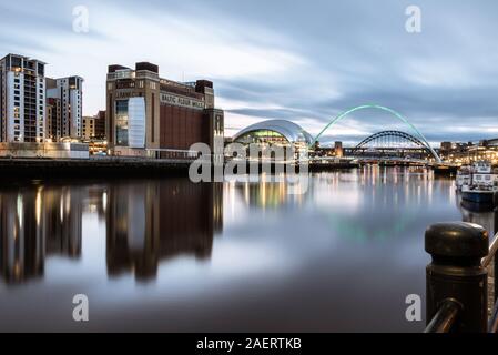 Looking up the river Tyne at dusk  on the 29th March 2019 at some of Newcastle upon Tyne best known landmarks from the Quayside with reflections Stock Photo