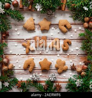 Gingerbread words Merry Christmas on the wooden background Stock Photo