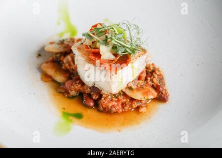 Codfish fillet with beans. Stock Photo