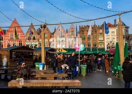 Bruges, Belgium - December 5, 2019: People in main Christmas Market square of Brugge