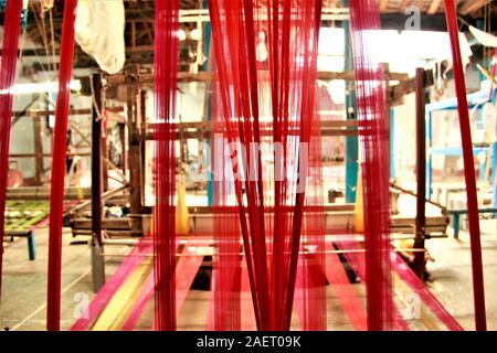 Colorful silk threads used in Indian hand looms. Hand looms are known for their richness, exquisiteness, variety and fine quality. Stock Photo