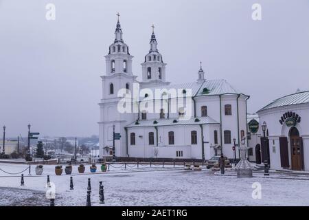 Minsk, Belarus - November 26, 2019: NemigaTrinity Suburb. The cathedral of Holy Spirit in the snow. Stock Photo