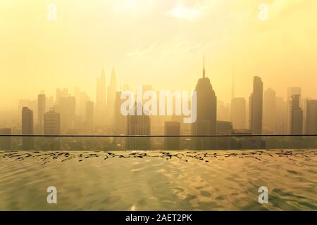 hot morning view of Kuala Lumpur with swimming pool on roof of scyscrapers Petronas (twin) towers,the heighest world buildings of 1998-2004 Stock Photo