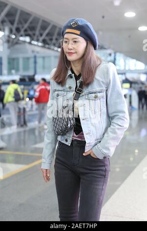 Chinese singer and actress Tan Weiwei arrives at a Beijing airport