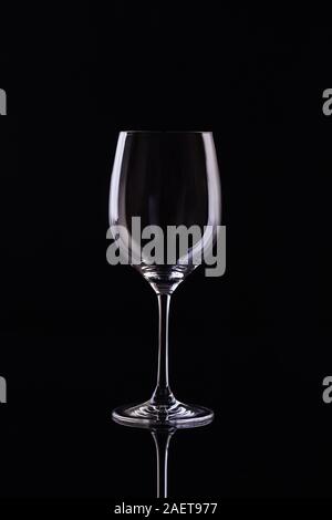 Empty Glass for wine on black background. Empty Glass of wine on black background. Wine on the dark Stock Photo