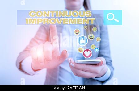 Conceptual hand writing showing Continuous Improvement. Concept meaning ongoing effort to improve products or processes Stock Photo