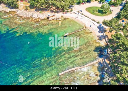 Camping by the sea and crystal clear stone beach aerial view in Savudrija, Istria region of Croatia Stock Photo