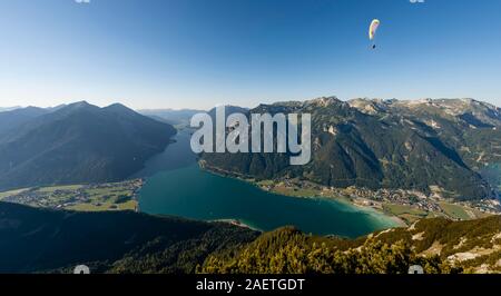 Mountain panorama from Baerenkopf, Paraglider, Lake Achen, left Seebergspitze and Seekarspitze, right Rofan Mountains, Tyrol, Austria Stock Photo