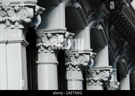 Cast iron Corinthian columns on building facade on Broadway, New York City. Stock Photo