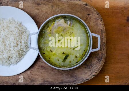Traditional Panamanian food known as 'Sancocho' or chicken soup accompanied with 'arroz blanco'  or white rice. Stock Photo