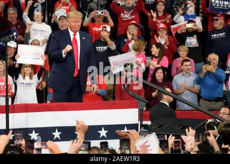 Hershey, Pennsylvania, USA. 10th December, 2019. U.S. President Donald Trump is welcomed on stage by Vice-President Mike Pence as they return to Pennsylvania for a a Keep America Great campaign rally at the Giant Center, in Hershey, PA, on December 10, 2019. Credit: OOgImages/Alamy Live News Stock Photo