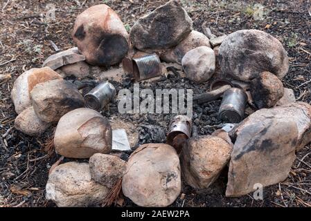 Garbage left in a campfire ring, Sawtooth Mountains, Idaho. Stock Photo