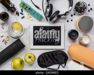 Biohacking flat lay concept. Top-down view of still life and word Bio Hacking on chalkboard Stock Photo