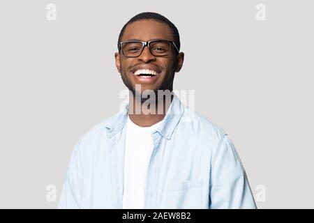 Joyful happy african american young man in eyeglasses portrait. Stock Photo