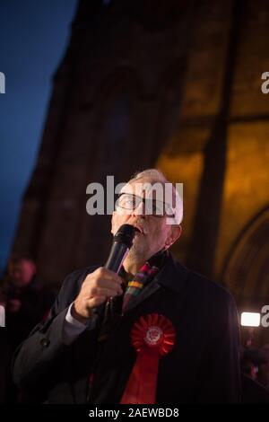 Glasgow, UK, 11 December 2019. Labour Party leader Jeremy Corbyn, accompanied by Richard Leonard, leader of Scottish Labour Party, campaigns at the historic Govan Cross, in Glasgow, the day before the nation goes to the polls in the 2019 General Election. Credit: Jeremy Sutton-Hibbert/Alamy Live News. Stock Photo