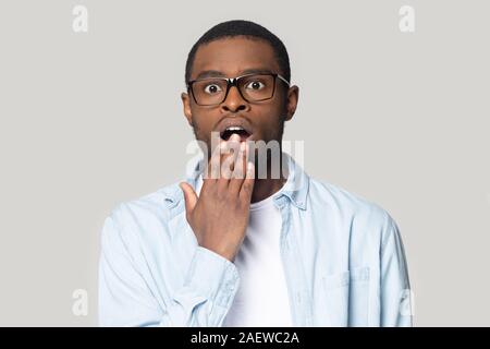 Surprised young african american man looking at camera. Stock Photo