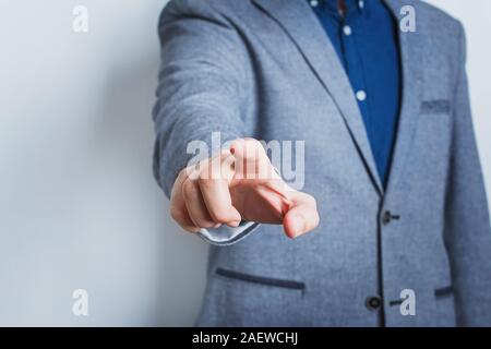 Man in suit pointing with his finger. Stock Photo