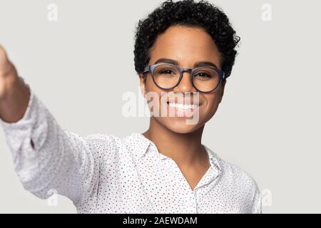 Joyful smiling african american young woman making selfie. Stock Photo