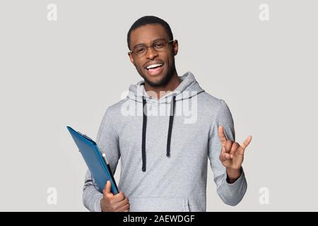 Young black professional standing with documents in folder. Stock Photo