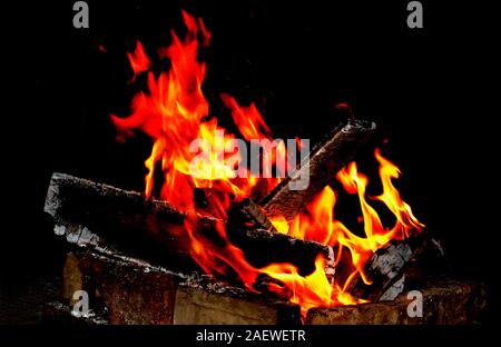 Closeup of blazing campfire coals in the evening. Stock Photo
