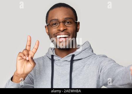 Webcam view happy african american guy in sportswear taking selfie. Stock Photo