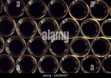 Close-up of large number of new metal pipes in a row in the metal factory Stock Photo