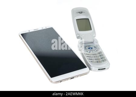 Two Phones - old phone and new smartphone isolated white background Stock Photo