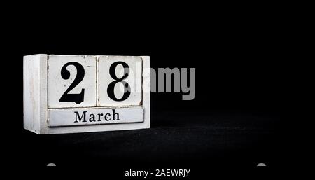 March 28th, Twenty-eighth of March, Day 28 of month March - white calendar blocks on black textured background with empty space for text Stock Photo