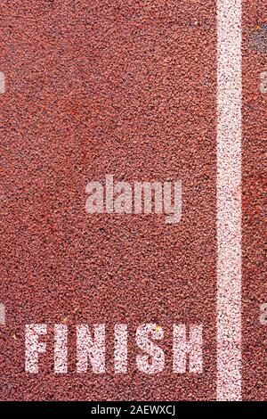 Run to the finish line. Concept for completion of a task or reaching goals. Stock Photo