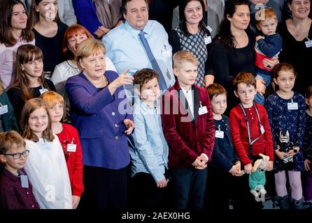 Berlin, Germany. 11th Dec, 2019. Federal Chancellor Angela Merkel (CDU, front row, 4th from left) receives in the Federal Chancellery the relatives of soldiers of the German Armed Forces as well as police officers on foreign missions. Credit: Kay Nietfeld/dpa/Alamy Live News Stock Photo