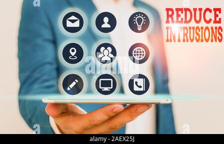 Handwriting text writing Reduce Intrusions. Conceptual photo a strategy to reduce and monitor false alarm rates Stock Photo